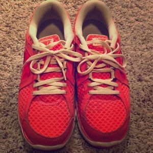 Coral Nike running shoes